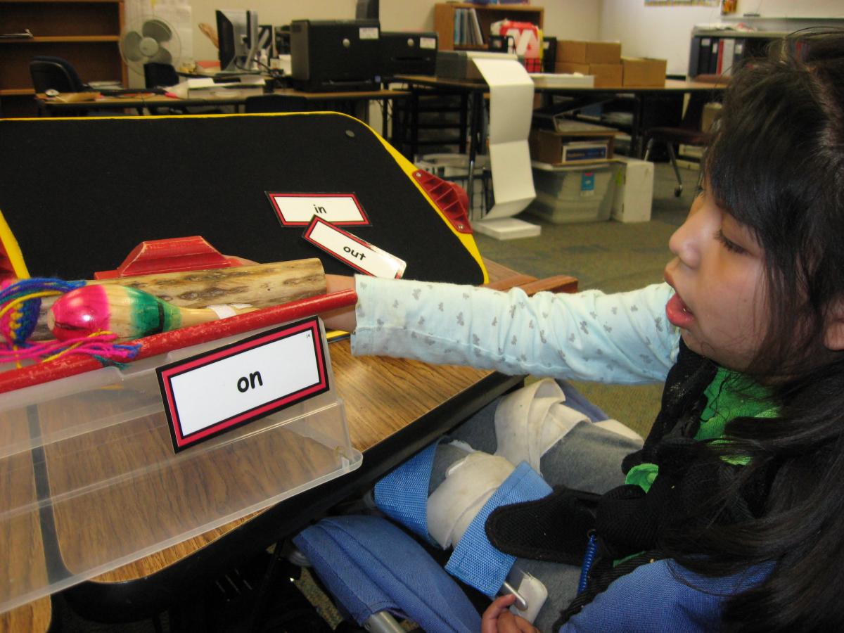 student using tactile items to learn