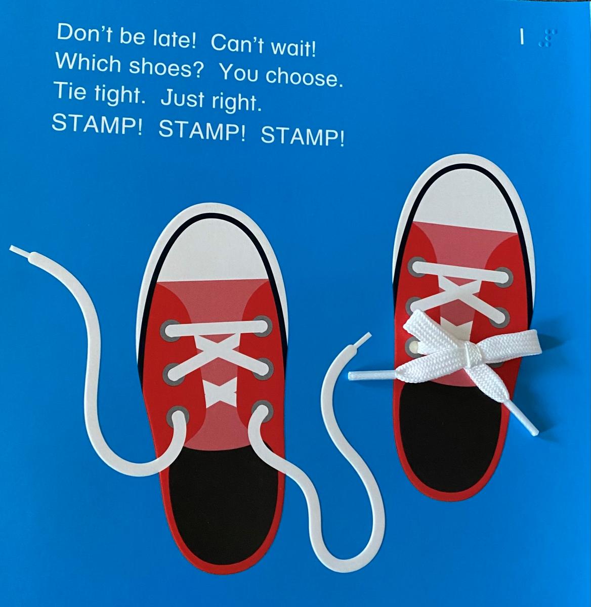 Page 1 of the book with sneakrs and actual laces 