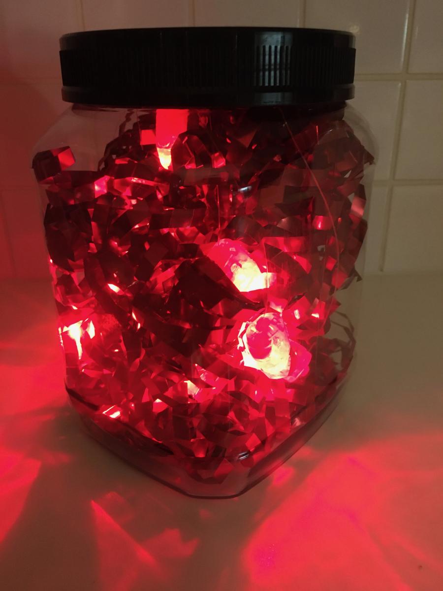 Red mylar garland in rectangular jar
