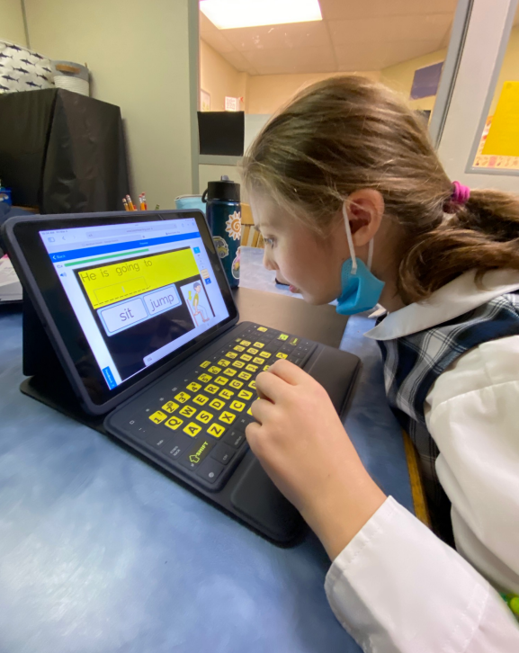 Student working on iPad with a boom card screen