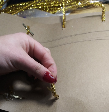 Securing pipe cleaner with a brass fastener