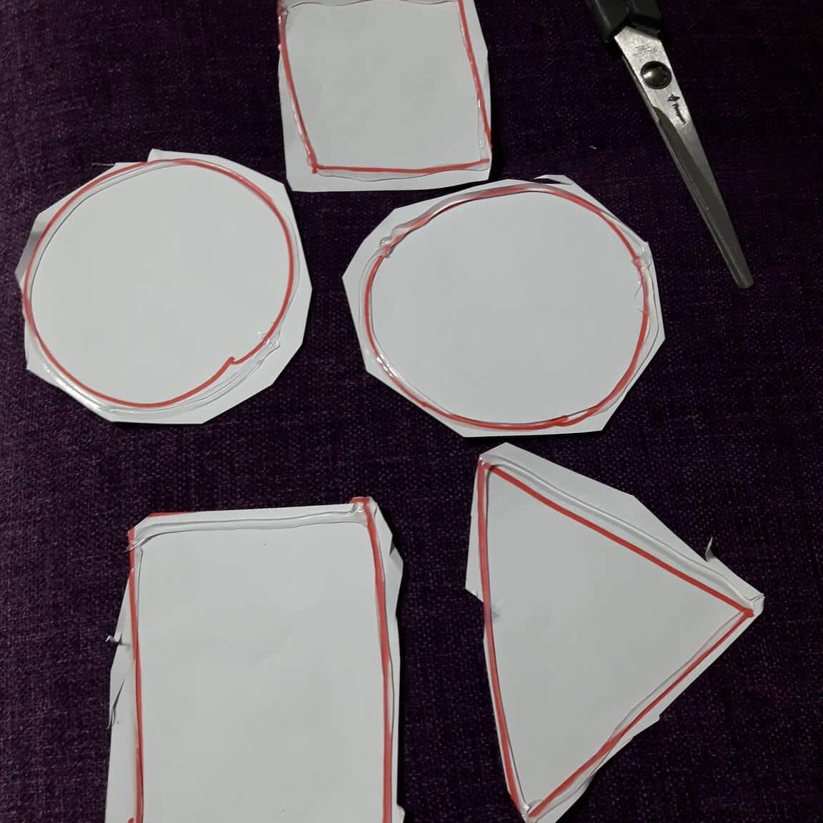 Shapes outlined with glue and cut out