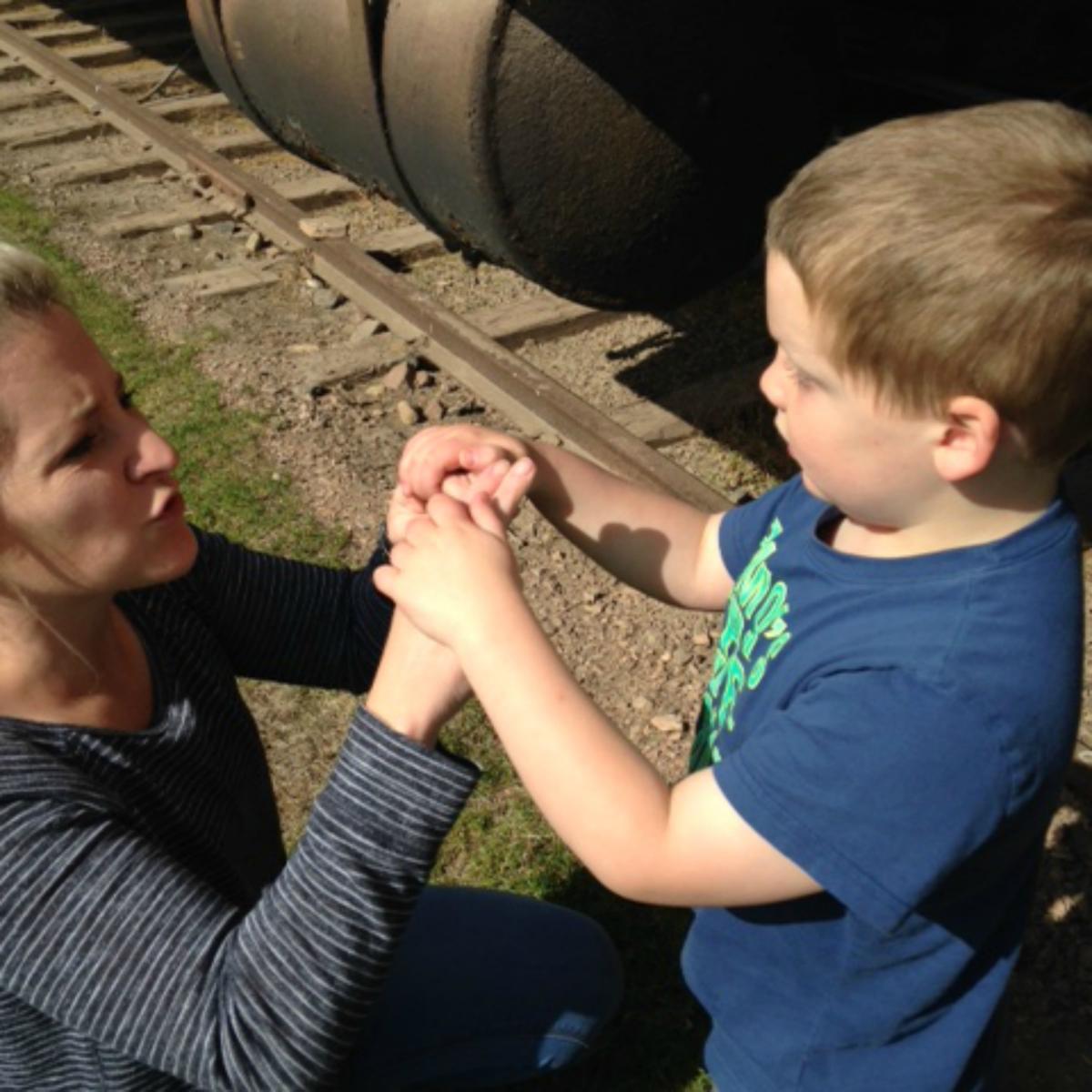 Mother signing to boy