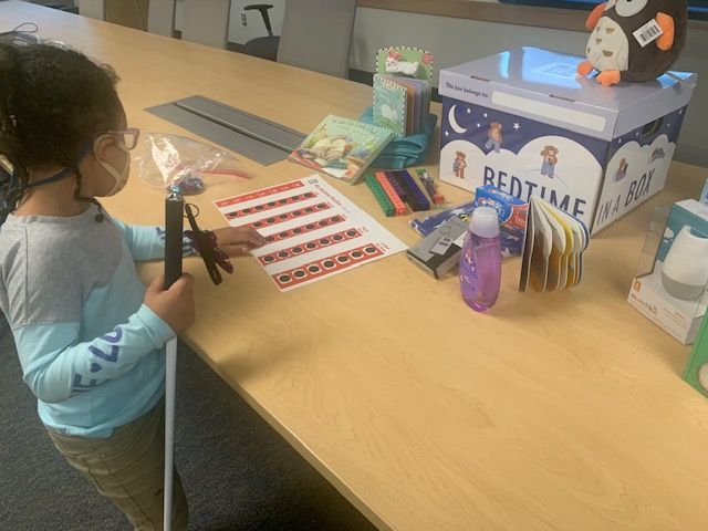 Young girl examining contents of box