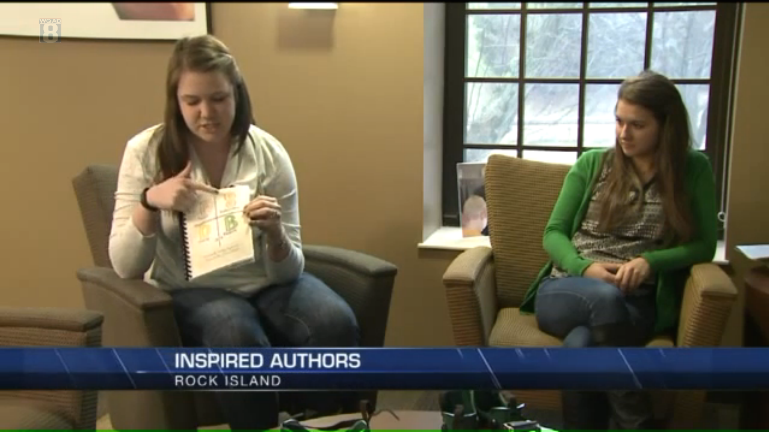 two girls sitting on chairs discussing their book