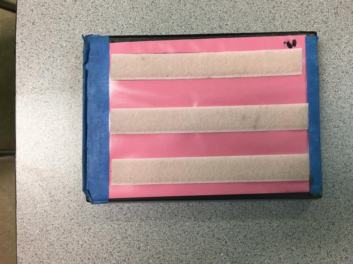Strips of Velcro on outside of case