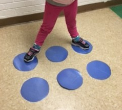 Standing on braille dots to make the letter "k"