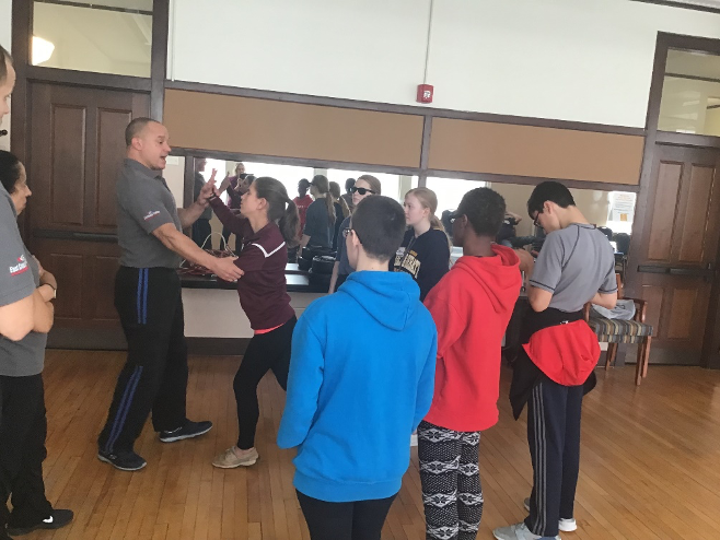Students participating in a self-defense class