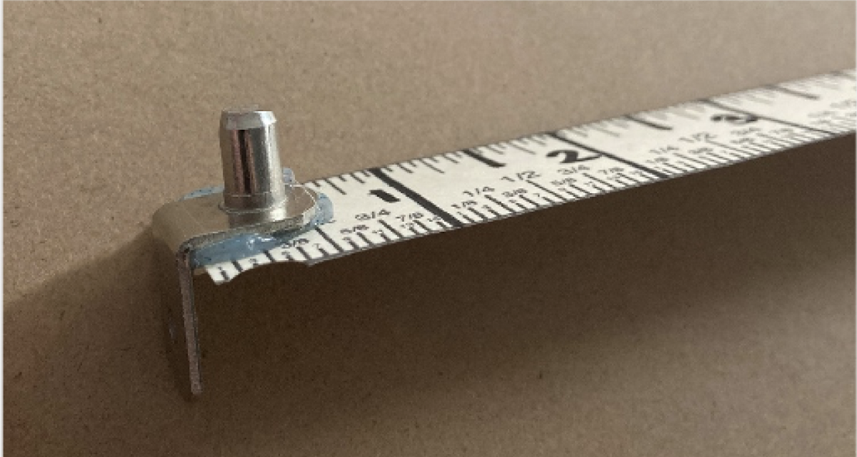 Ruler with L-shaped support peg