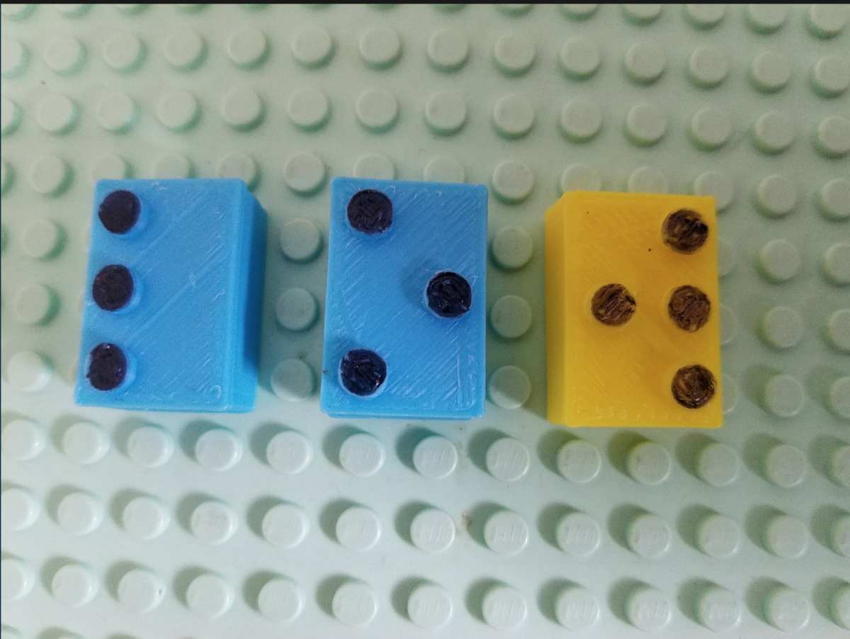 3D braille legos spelling out "low"