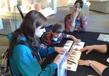 A child who was averse to reading braille exercised his tactile literacy on an outing to a tactile exhibit with a proficient braille reader