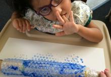 Girl doing bubble wrap painting