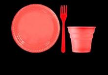 Red plate, fork, and cup on black background