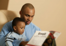 Father reading with young son