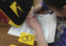 student using symbols to make a list