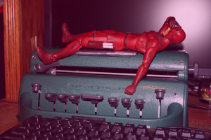 Picture of a Perkins Braillewriter with a Daredevil action figure on top