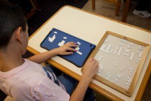 Boy works on mathematics problem.