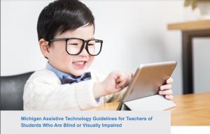 A young boy with eyeglasses using an iPad