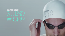 Man putting on digital swim cap