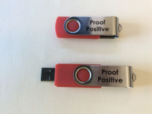 two flash drives with "Proof Positive" written on them