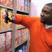 Shopper using glove to identify cereal boxes