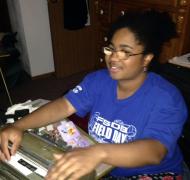 Jasmyn using a braillewriter