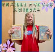 Noye holding up two books with the title above: Braille Across America