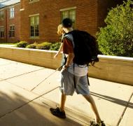Student walking with cane
