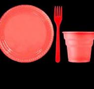 Red plate, fork, and cup on black background
