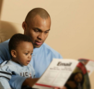 Father reading with young son