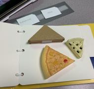 Page from tactile book with 3 triangular shaped food items