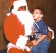 Child sits on Santas lap