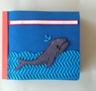 Tactile Book of Endangered Animals-there is a whale floating in the sea on the cover of the book