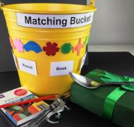 matching bucket - yellow pail with different items, spoon, pencil, book