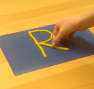 Making the letter "R" with pipe cleaners