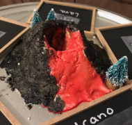 close up of the volcano project with the vocabulary cards around it