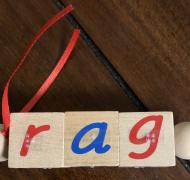 Wood blocks spelling the word "rag"