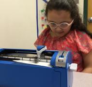 Student using braille writer