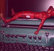 Picture of a Perkins Braillewriter with a Daredevil action figure on top