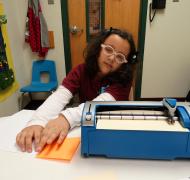 student using braillewriter