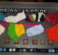 A cookie sheet with pairs of items (socks, gloves, coins, buttons, etc.)