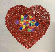 Heart made of colored buttons