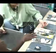 Screenshot of a student who is deafblind examining his object calendar.