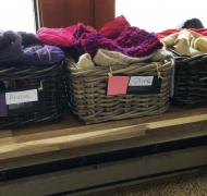 baskets in a mudroom filled with winter clothing