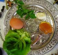 a seder plate with traditional foods for Passover