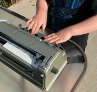 Boy using a braillewriter