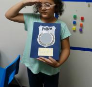 girl holding police letter