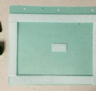 Velcro around perimeter of paper with two square wooden blocks on the left side.