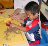 Young boy playing in sand tray