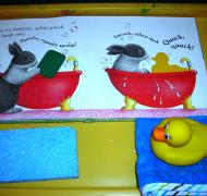 Photo of picture book with sponge and rubber duck as part of story box